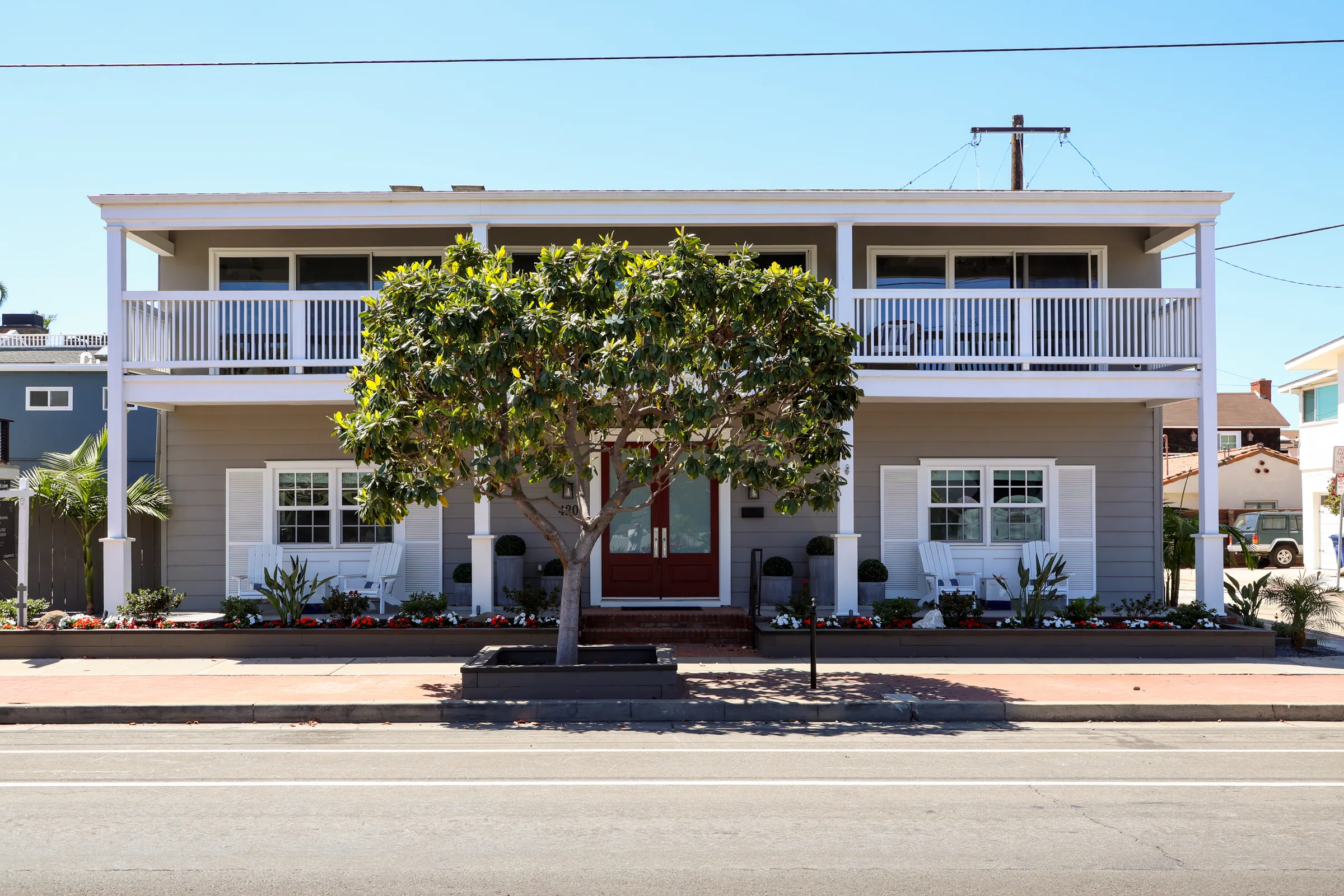 Coastal Coronado home with mature magnolia, hand-tended landscape design