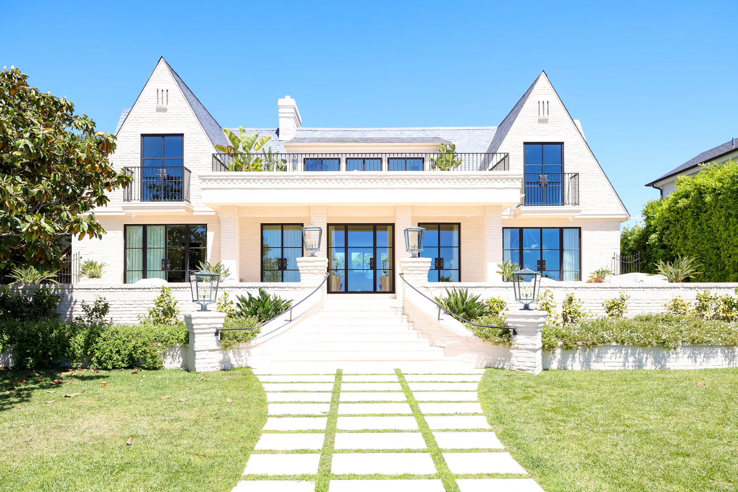 White Coronado estate with hand-tended landscape by Ecosystem Landscaping