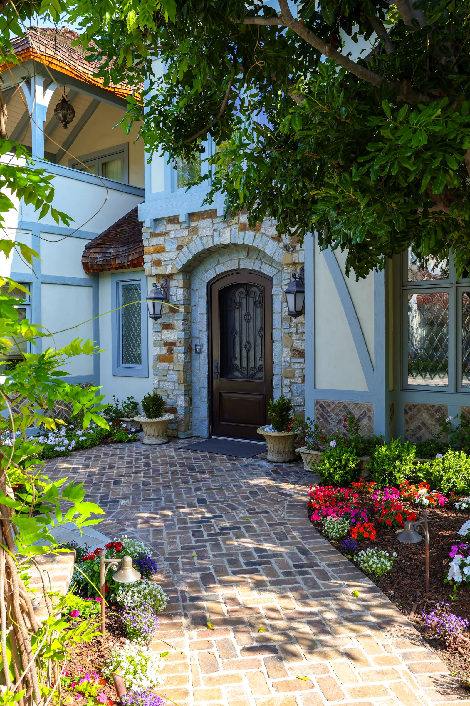 Brick walkway entry to a Point Loma Tudor home