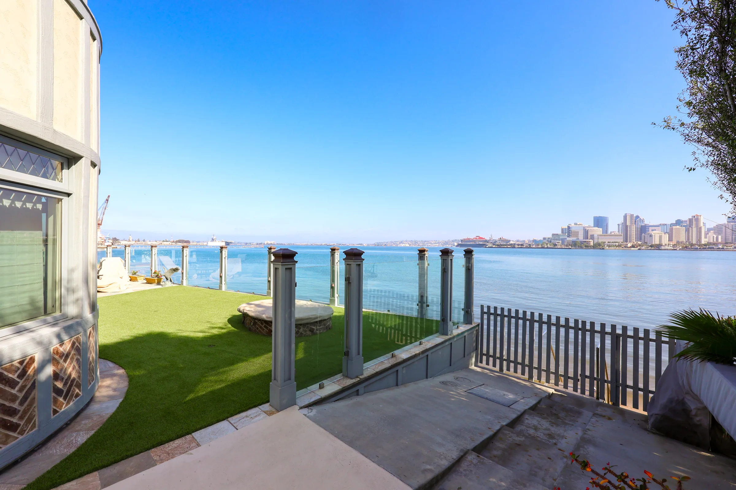 Bayfront Coronado patio with fire pit and San Diego skyline view